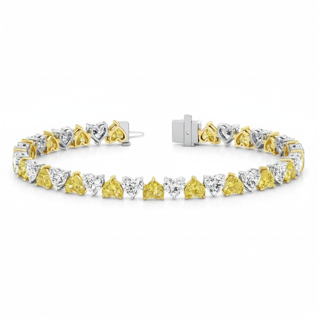 My Store 4 two-tone tennis bracelet featuring alternating fancy yellow and white heart-cut diamonds in gold settings.