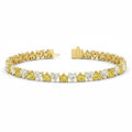 My Store 4 two-tone tennis bracelet featuring alternating fancy yellow and white heart-cut diamonds in gold settings.