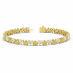 My Store 4 two-tone tennis bracelet featuring alternating fancy yellow and white heart-cut diamonds in gold settings.