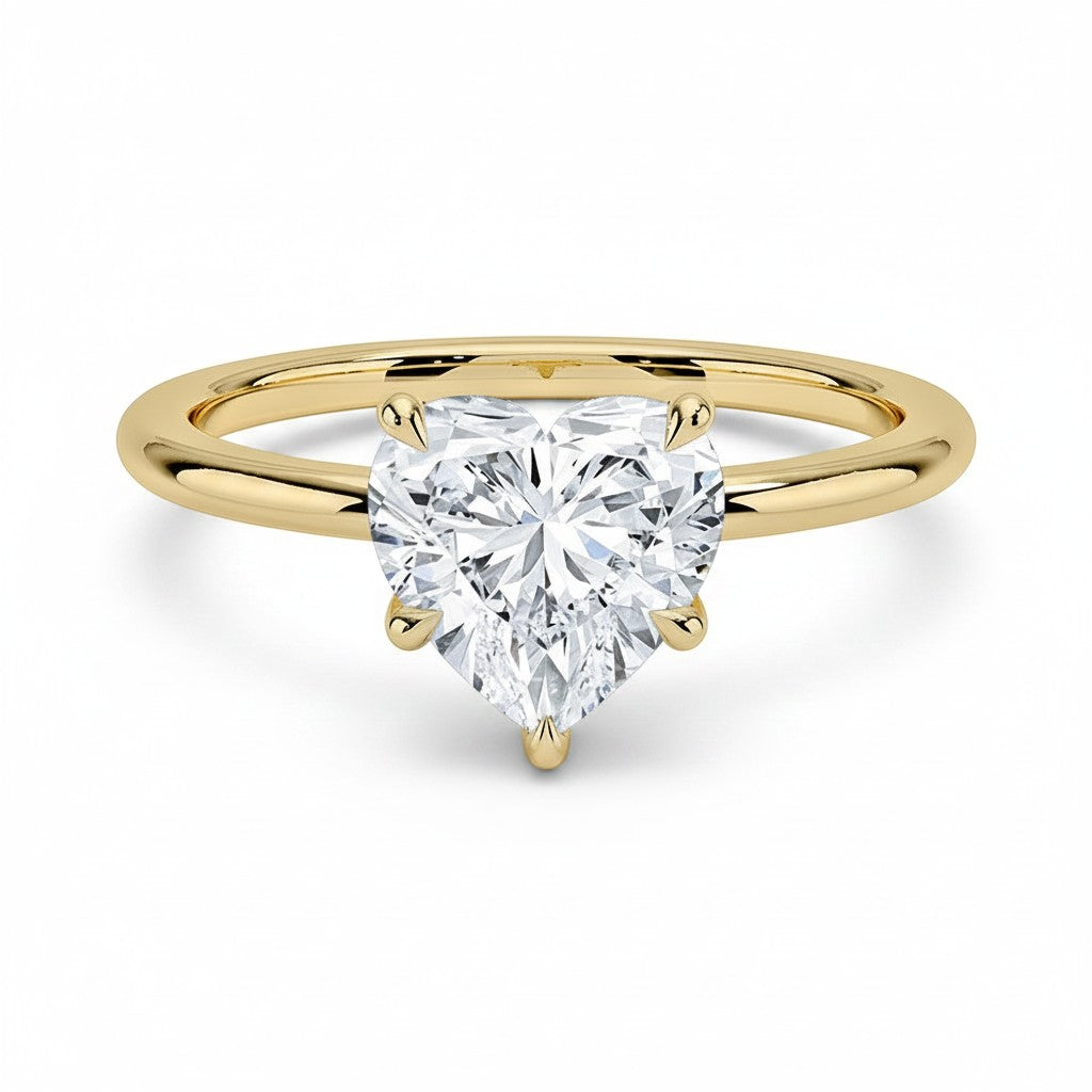My Store 4 18K solid gold solitaire ring featuring a heart-shaped diamond set on a polished yellow gold band