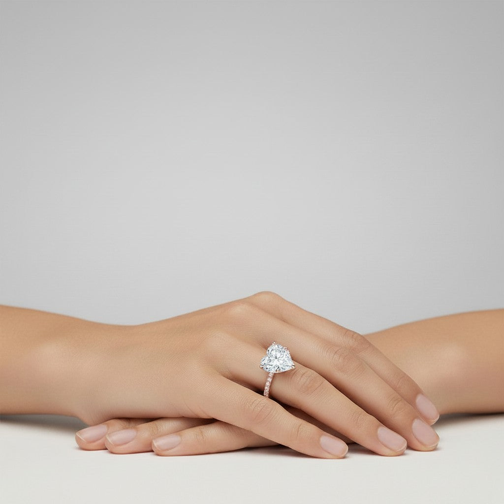 My Store 4 18K solid gold lab-grown diamond solitaire ring with heart-shaped stone and pavé band on a woman's hand.
