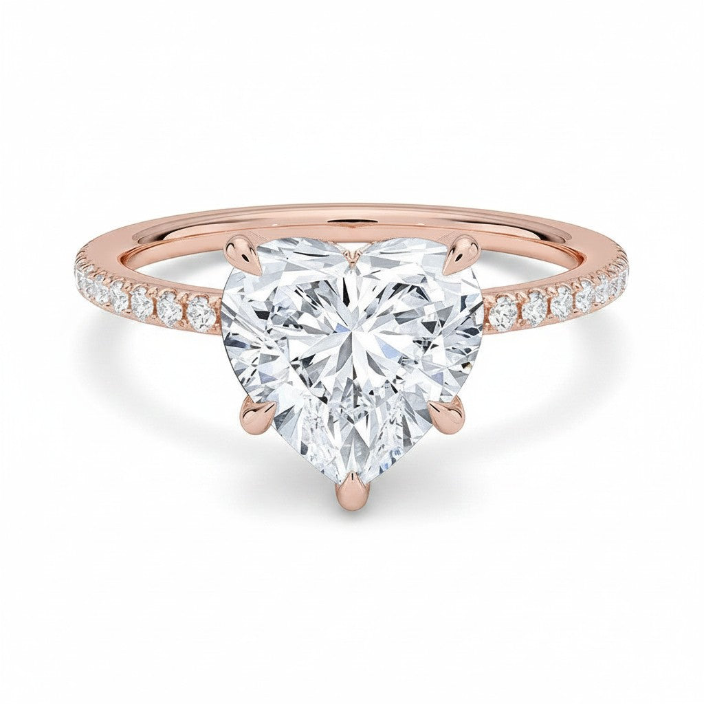 My Store 4 18K rose gold heart-shaped lab-grown diamond solitaire ring with pavé band on a white background.