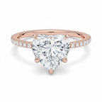 My Store 4 18K rose gold heart-shaped lab-grown diamond solitaire ring with pavé band on a white background.