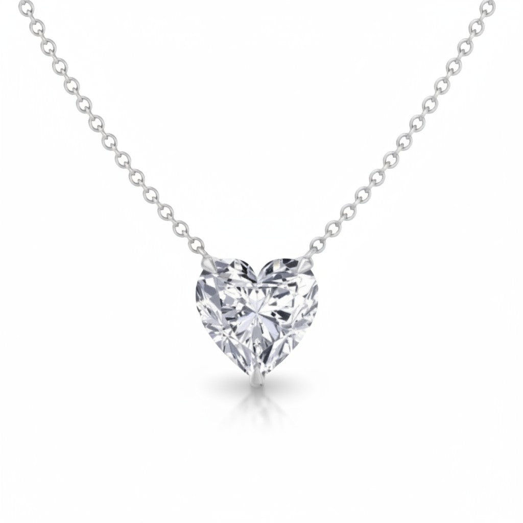 My Store 4 heart-cut diamond solitaire pendant necklace in white gold with a bail-free floating chain design.