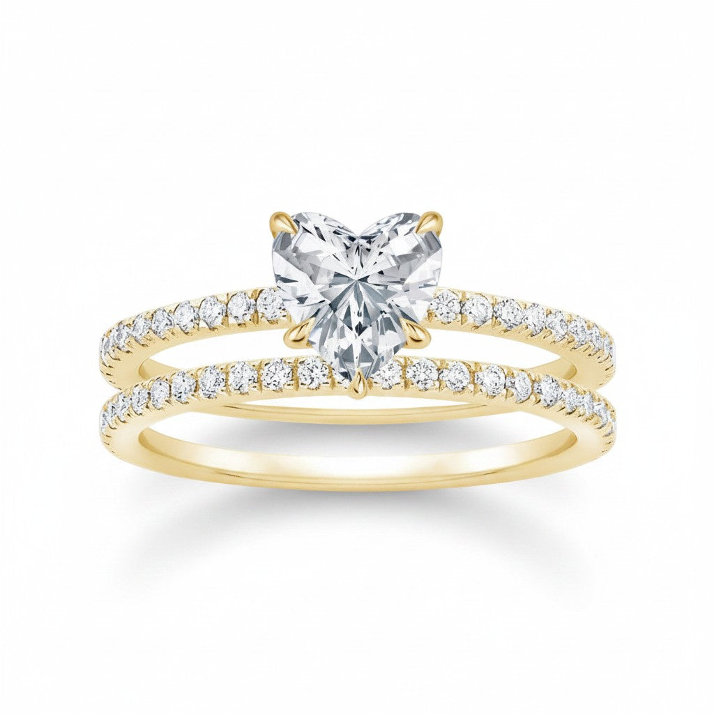 My Store 4 heart-cut diamond engagement ring and matching pavé wedding band set in 18k yellow gold.