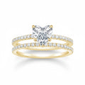 My Store 4 heart-cut diamond engagement ring and matching pavé wedding band set in 18k yellow gold.