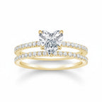 My Store 4 heart-cut diamond engagement ring and matching pavé wedding band set in 18k yellow gold.