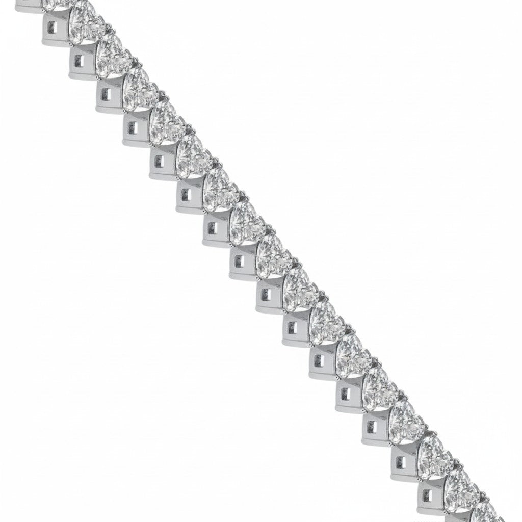 My Store 4 tennis bracelet featuring a continuous line of heart-cut white diamonds in solid gold heart-shaped baskets.