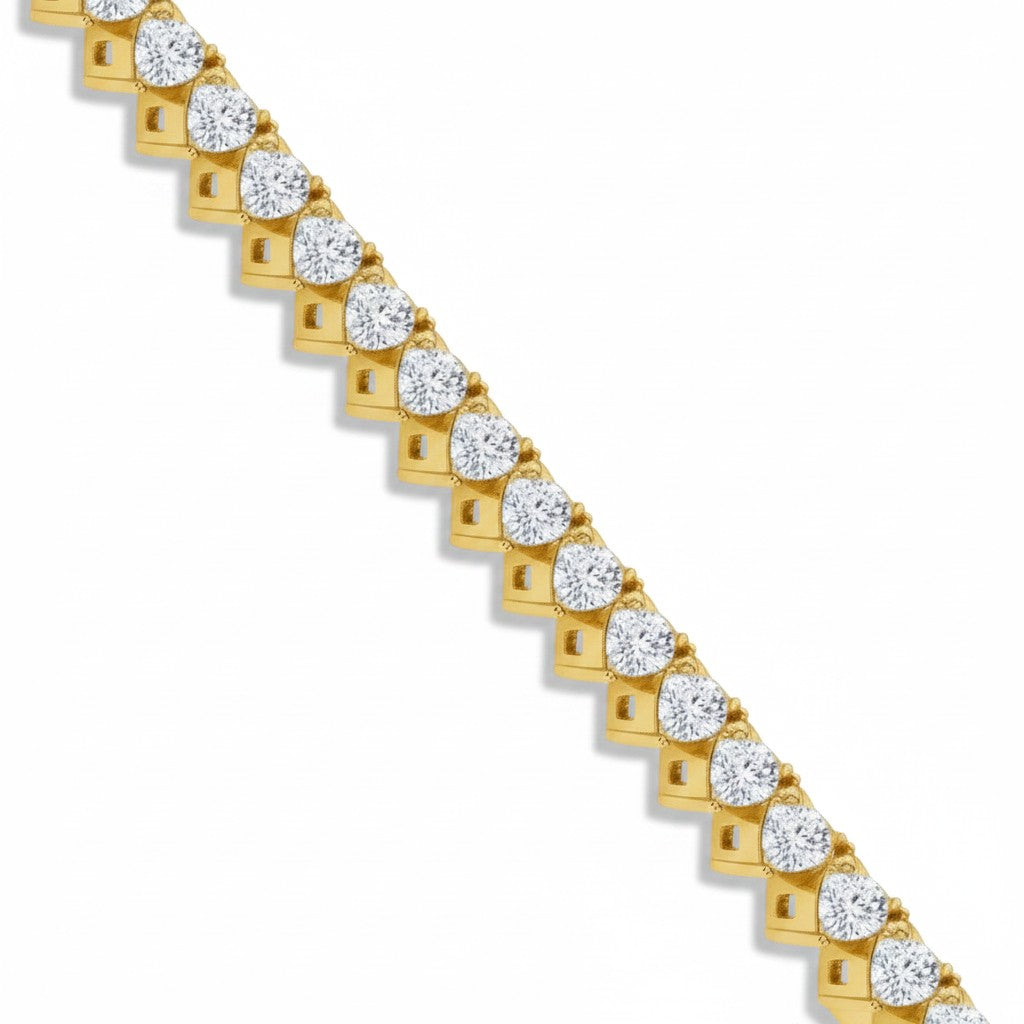 My Store 4 tennis bracelet featuring a row of heart-cut white diamonds set in yellow gold heart-shaped baskets.