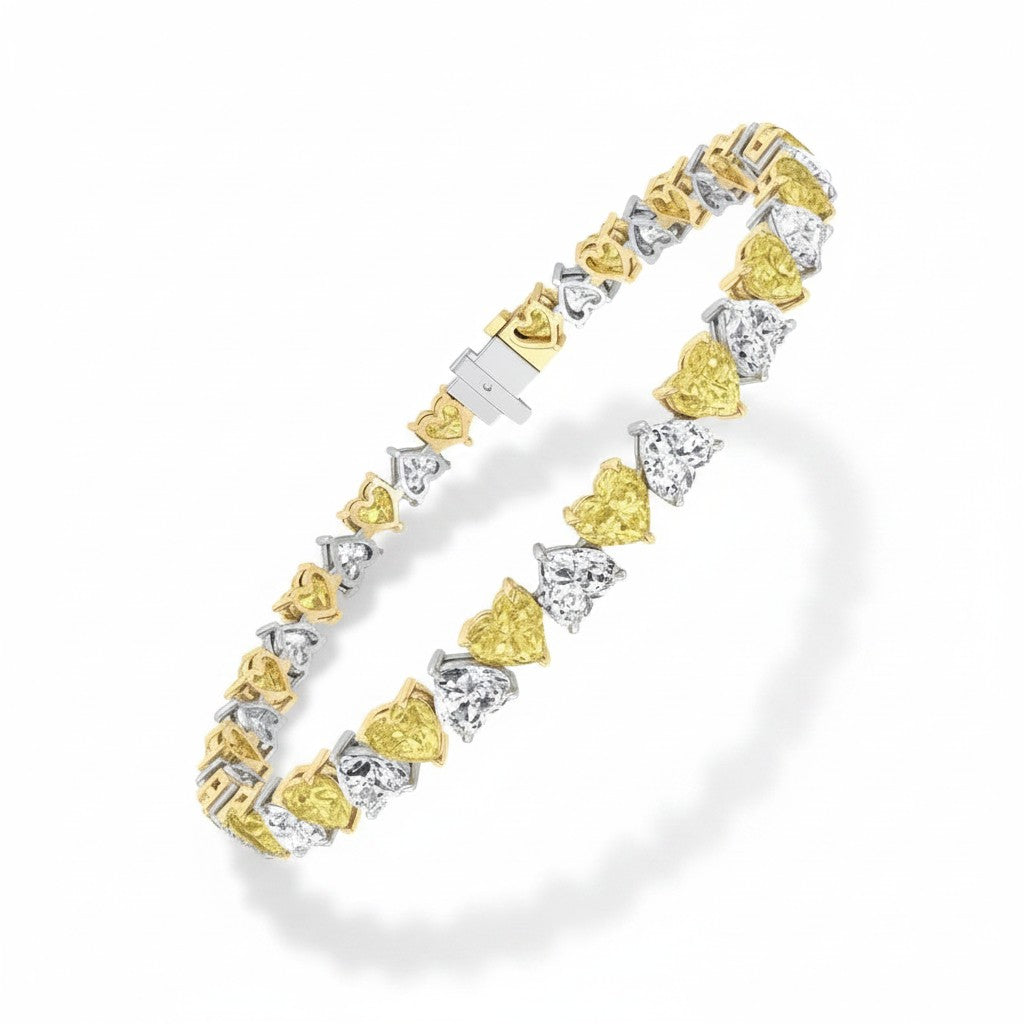 My Store 4 tennis bracelet featuring alternating fancy yellow and white heart-cut diamonds in two-tone gold settings.