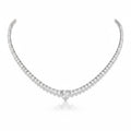 My Store 4 heart-shaped diamond solitaire tennis necklace in white gold with a continuous strand of round diamonds.