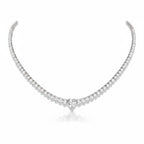 My Store 4 heart-shaped diamond solitaire tennis necklace in white gold with a continuous strand of round diamonds.