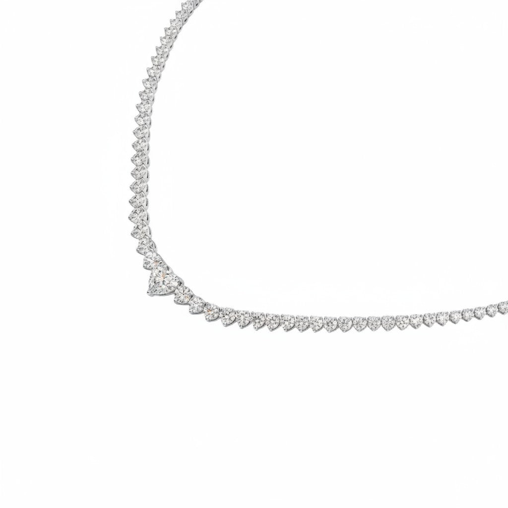 My Store 4 heart center solitaire diamond tennis necklace in white gold with a brilliant round diamond strand.