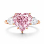 My Store 4 18K solid gold trilogy ring featuring a heart-cut fancy pink lab-grown diamond and two side diamonds.