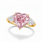 My Store 4 18K gold trilogy ring featuring a heart-cut fancy pink lab-grown diamond with two side pear-cut diamonds.