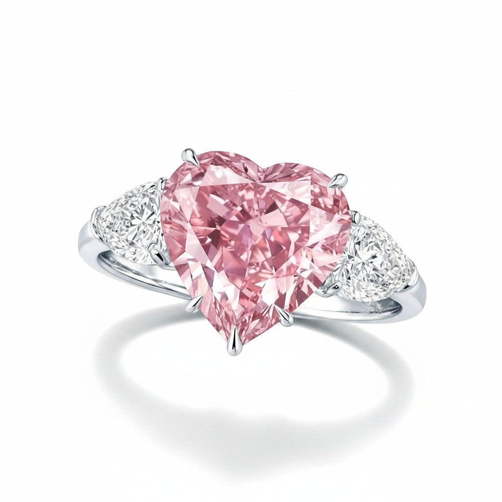 My Store 4 18K solid gold trilogy ring featuring a heart-cut fancy pink lab-grown diamond and side accent stones.