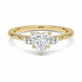 My Store 4 18K solid gold trilogy ring featuring a heart-shaped lab-grown diamond flanked by two pear-cut diamonds.