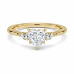 My Store 4 18K solid gold trilogy ring featuring a heart-shaped lab-grown diamond flanked by two pear-cut diamonds.