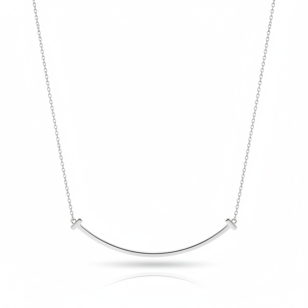 My Store 4 large smile diamond necklace in polished white gold with a curved bar and T-bar ends on a trace chain
