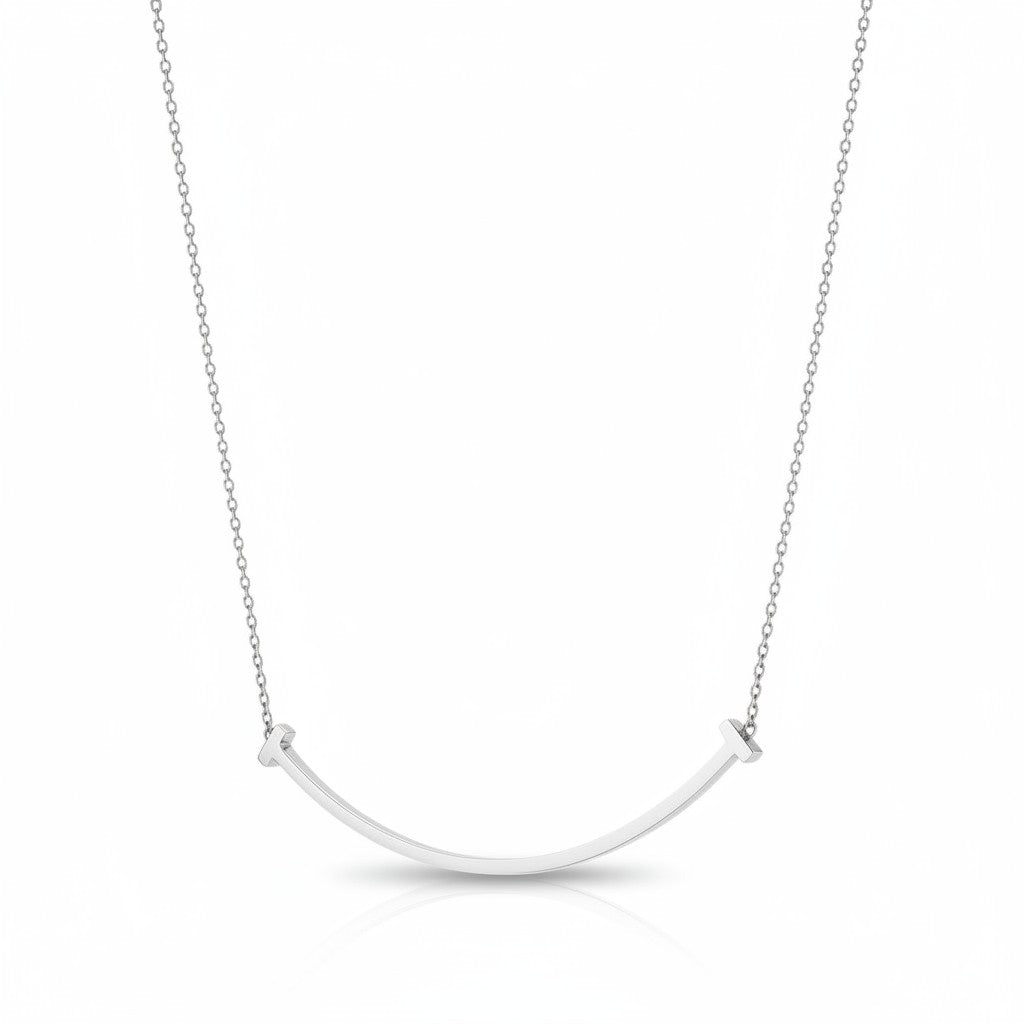My Store 4 large smile diamond necklace in white gold with a curved bar and T-bar ends on a delicate trace chain.