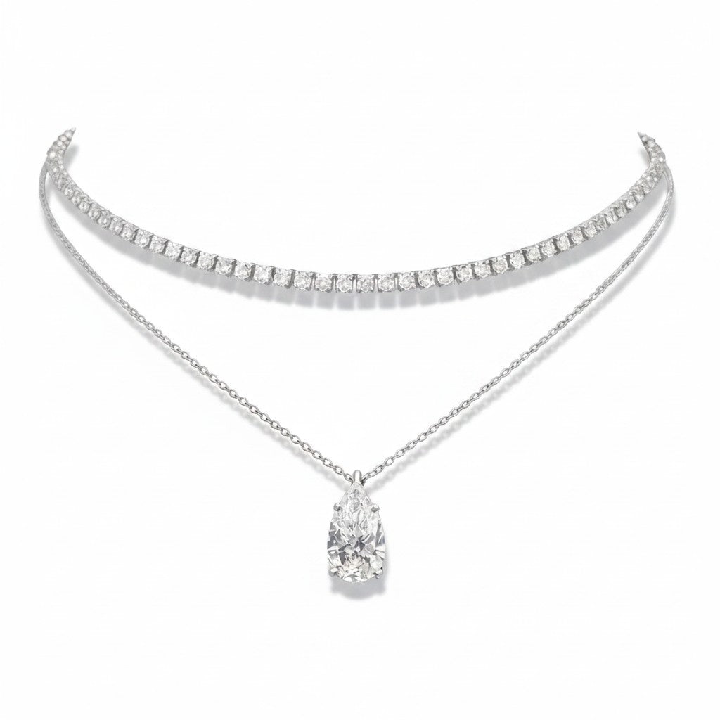 My Store 4 layered necklace set featuring a diamond tennis choker and a pear-cut solitaire pendant in white gold.