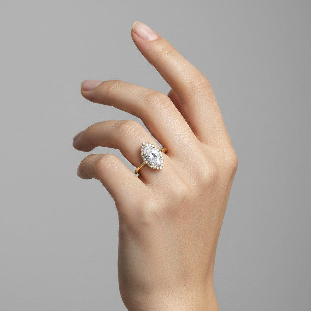 My Store 4 18K solid gold marquise lab-grown diamond halo ring worn on a woman's finger