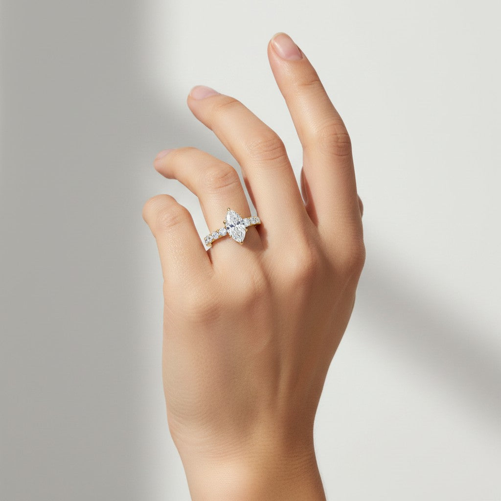My Store 4 18K solid gold marquise lab diamond engagement ring set with pavé band worn on a woman's hand