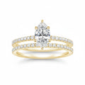 My Store 4 marquise diamond engagement ring and matching pavé wedding band set in 18K yellow gold.