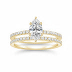 My Store 4 marquise diamond engagement ring and matching pavé wedding band set in 18K yellow gold.