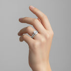 My Store 4 marquise diamond engagement ring and matching pavé wedding band set worn on a woman's finger.