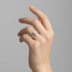 My Store 4 marquise diamond engagement ring and matching pavé wedding band set worn on a woman's finger.