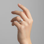 My Store 4 marquise diamond engagement ring and matching pavé wedding band set worn on a woman's finger.