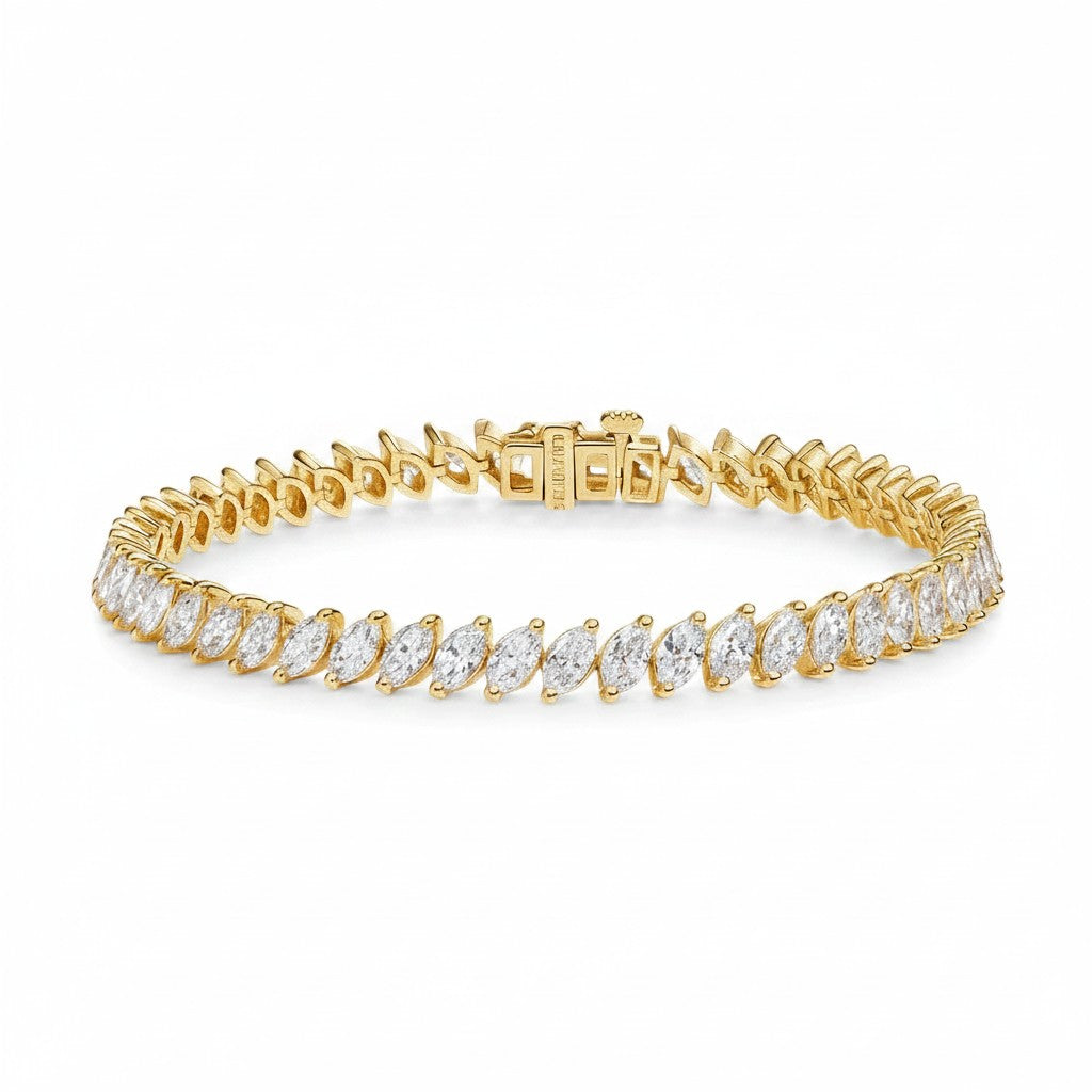 My Store 4 marquise cut diamond tennis bracelet in yellow gold with a secure box clasp on a white background.
