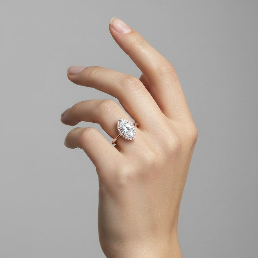 My Store 4 18K solid gold heritage halo ring featuring a marquise-cut lab-grown diamond on a woman's finger