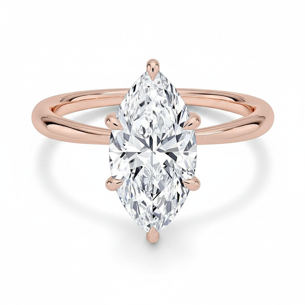 My Store 4 18K rose gold solitaire ring featuring a marquise-cut lab-grown diamond on a polished band