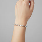 My Store 4 marquise and round diamond tennis bracelet in white gold worn on a wrist