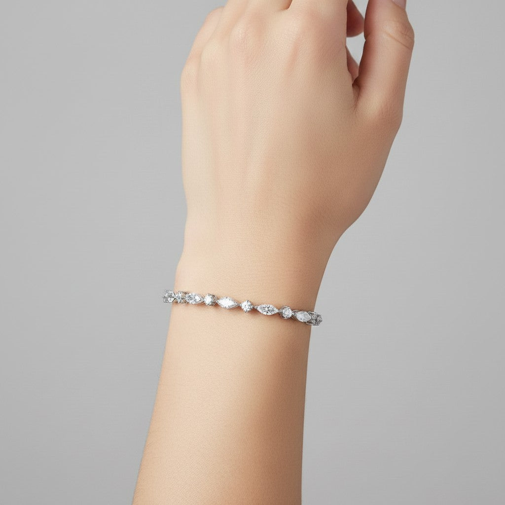 My Store 4 marquise and round diamond tennis bracelet in white gold worn on a wrist
