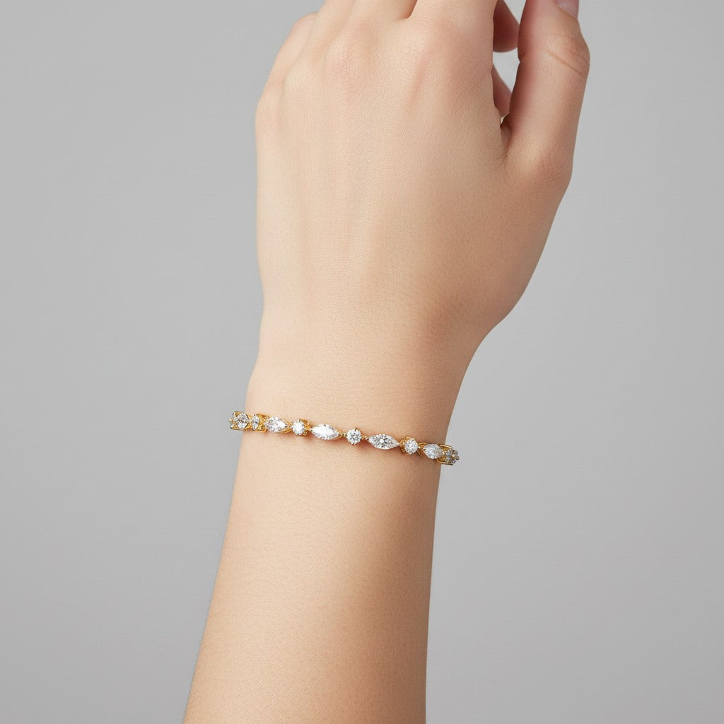 My Store 4 gold tennis bracelet featuring alternating marquise and round brilliant diamonds worn on a wrist.