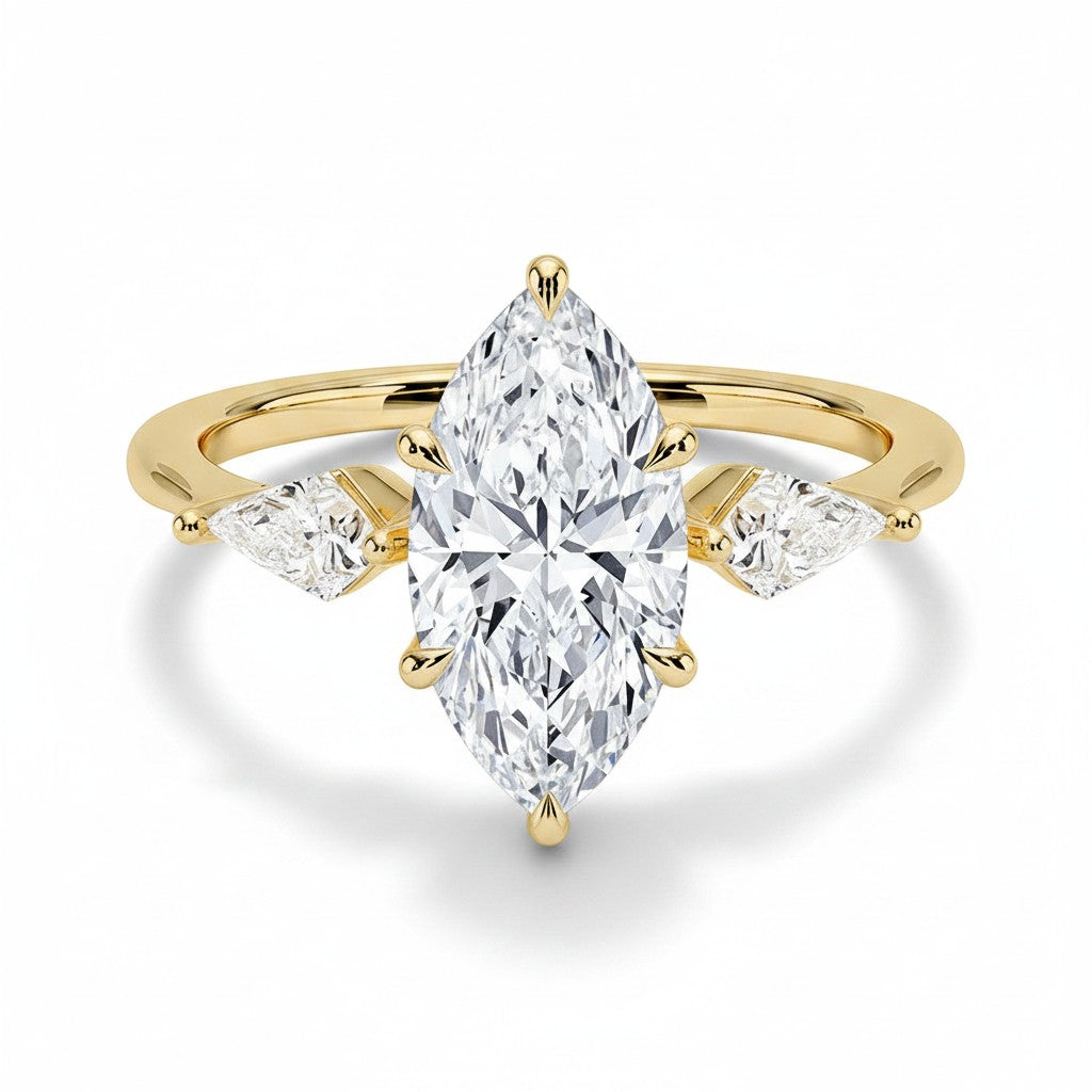 My Store 4 18K solid gold trilogy ring featuring a central marquise-cut lab-grown diamond with two pear-cut side stones.