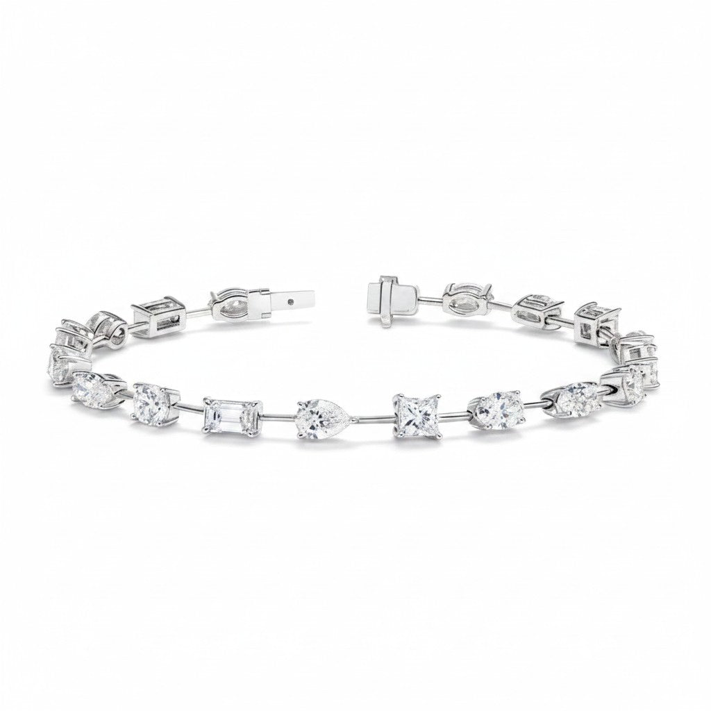 My Store 4 tennis bracelet featuring mixed fancy cut diamonds in pear, emerald, princess, oval, and round shapes.