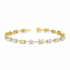My Store 4 gold tennis bracelet featuring a mix of pear, emerald, princess, oval, and round cut diamonds in baskets.