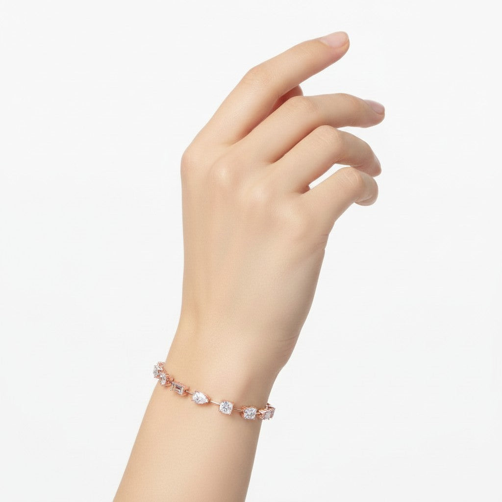 My Store 4 rose gold tennis bracelet featuring mixed fancy cut diamonds on a woman's wrist