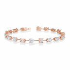 My Store 4 rose gold tennis bracelet featuring a mix of pear, emerald, princess, oval, and round cut diamonds.