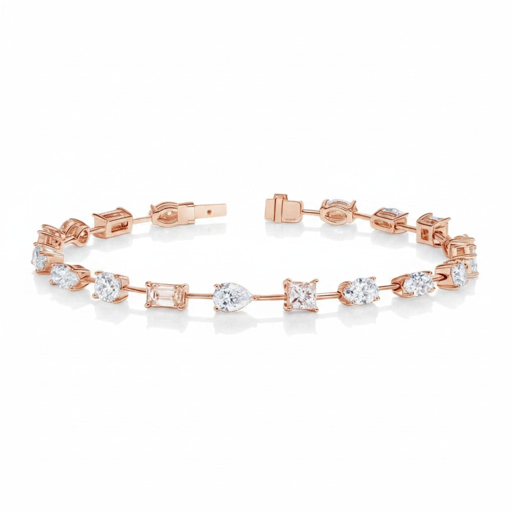 My Store 4 rose gold tennis bracelet featuring a mix of pear, emerald, princess, oval, and round cut diamonds.