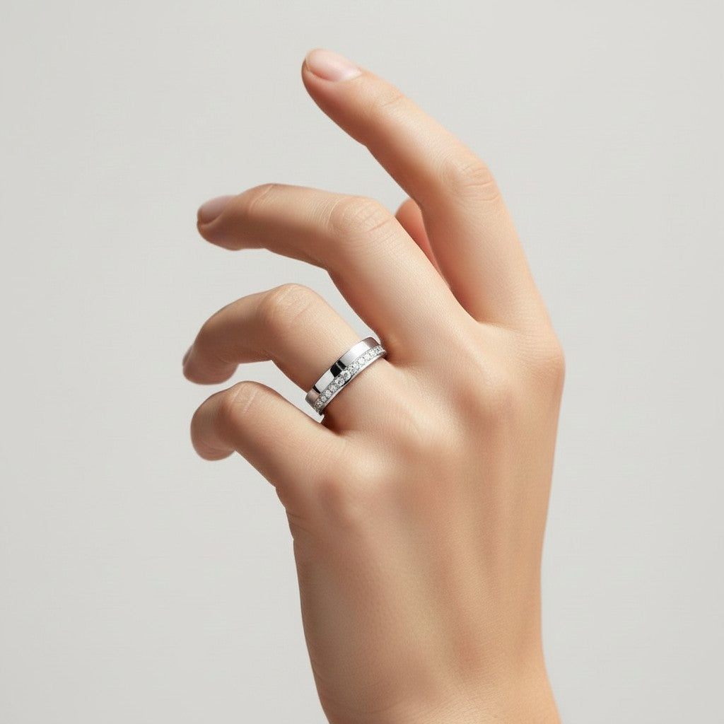 My Store 4 offset diamond channel flat band ring in white gold worn on a hand, featuring a modern brushed finish.