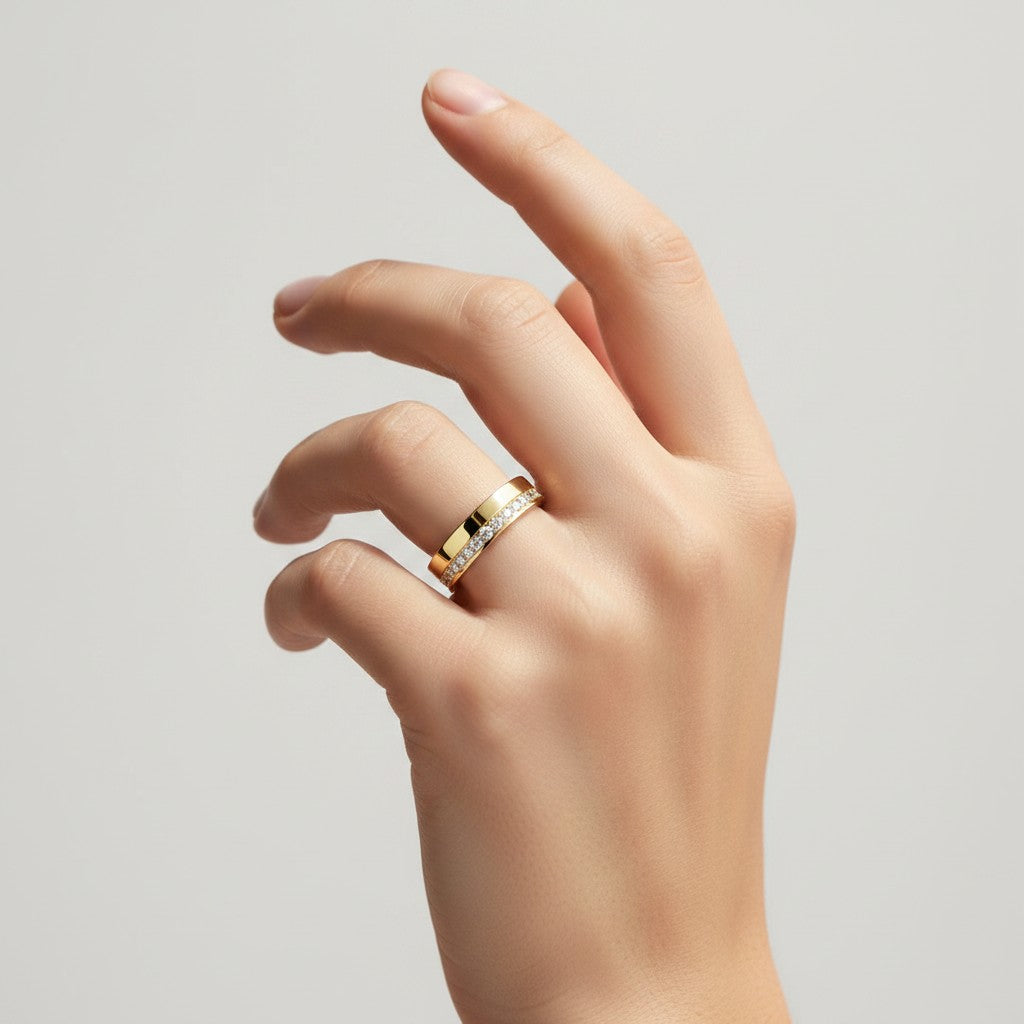 My Store 4 solid yellow gold flat band ring featuring an offset channel of brilliant diamonds on a model hand