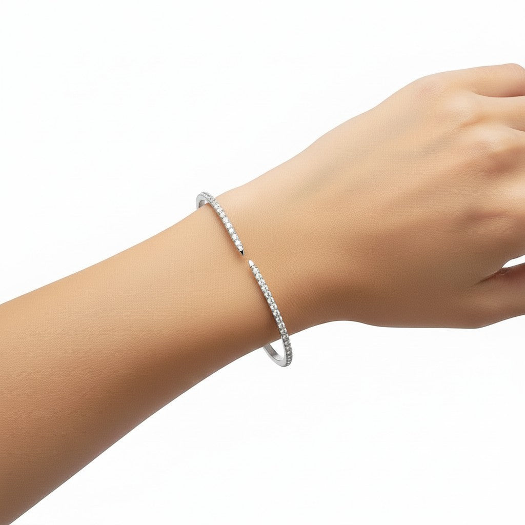 My Store 4 open pavé diamond bangle bracelet in white gold worn on a wrist, featuring a sleek flex cuff design.