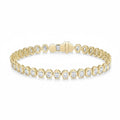 My Store 4 oval cut diamond tennis bracelet in 14K yellow gold with a protective bezel setting and secure box clasp.