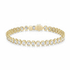 My Store 4 oval cut diamond tennis bracelet in 14K yellow gold with a protective bezel setting and secure box clasp.