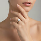 My Store 4 18K solid gold bridal set with a 1.5ct oval lab-grown diamond and marquise accent stones on a woman's hand
